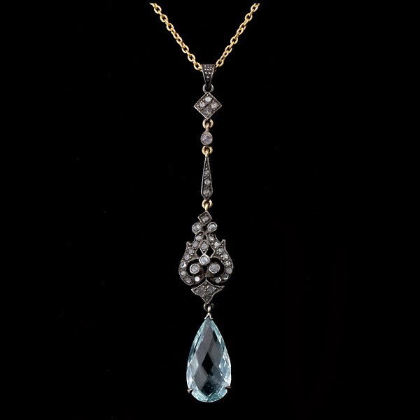 AQUAMARINE, DIAMOND, SILVER, 14K Y/G NECKLACE.: AQUAMARINE, DIAMOND, SILVER, 14K YELLOW GOLD NECKLACE. Featuring one pear shape aquamarine weighing approximately 1.85 ct., accented by thirty-four rose-cut diamonds, prong and bead set in silver topp