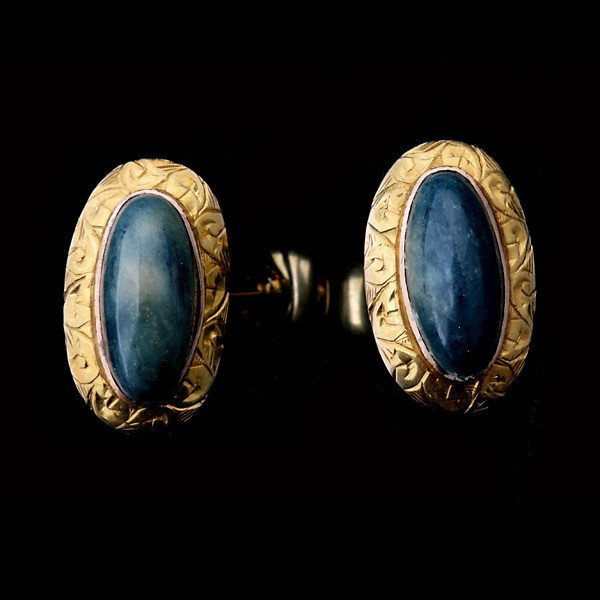 PAIR OF AGATE, 14K YELLOW GOLD CUFFLINKS.: PAIR OF AGATE, 14K YELLOW GOLD CUFFLINKS. Each features one oval agate cabochon, measuring approximately 12 mm x 6 mm, bezel set in a 14k yellow gold engraved frame with a fixed bar bell. 2.9 dwts