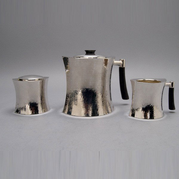 Christofle Hammered Sterling 3 Piece Tea Service: Christofle Hammered Sterling Three Piece Tea Service Fitted with Ebonized Wood Handles {Total silver weight including handles 42.84 troy oz; height of teapot 6 1/2 inches}