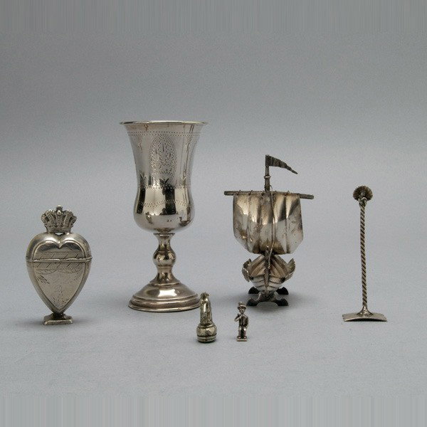 Sterling and Silver Group (6): Sterling and Silver Group: a heart shaped box; a horse form seat; a shell food pusher; a goblet; a Viking boat; and a charm (6) {Total silver weight 4.21 troy oz; height of goblet 5 inches}