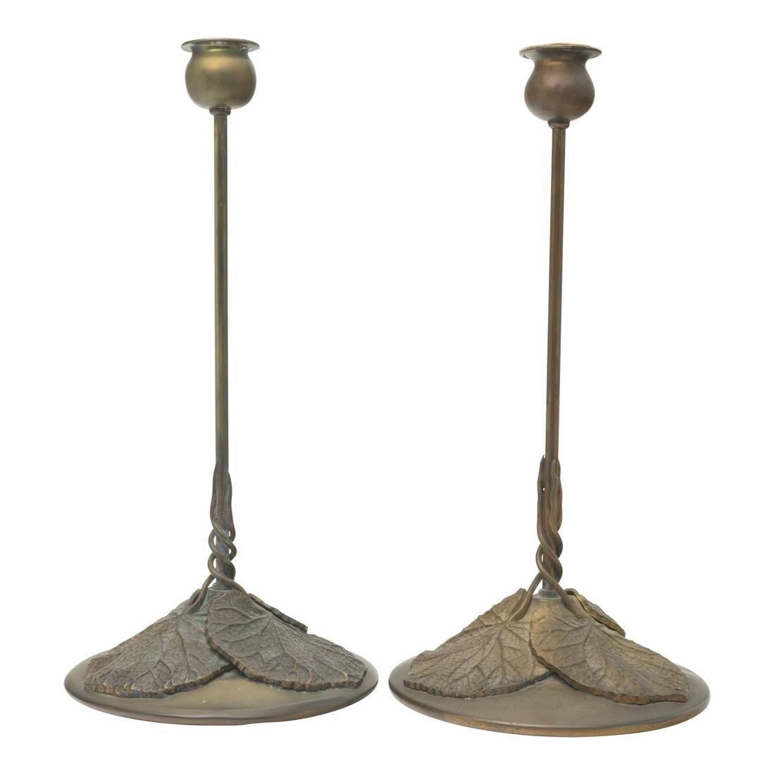 Pair of Arts and Crafts Riviere Studios Candlesticks: Pair of Arts and Crafts Riviere Studios Candlesticks. Bulb-form candleholders, long and slender neck, round base each with three lilypads, the stems winding around the neck. Marked 'RIVIERE STUDIOS /