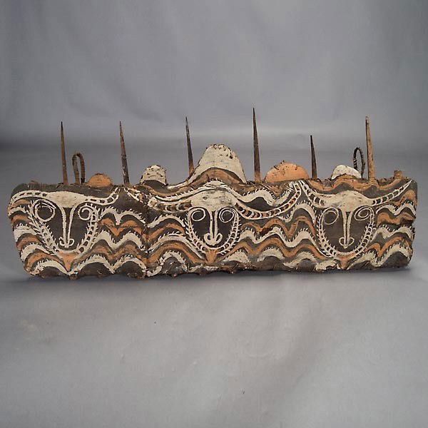 Papua New Guinea painted bark rack: SEPIK river region rack. Bark and cane with bambo spikes, black, white, and orange pigments. Width 49 inches. In good condition.
