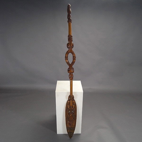 Maori New Zealand canoe paddle: MAORI canoe paddle. Circa 1990. Wood with brown satin gloss finish, mother-of-pearl eyes. Length 90 inches.