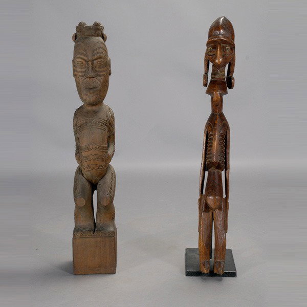 Two Polynesian carvings Maori Easter Island: Two POLYNESIAN carvings. A MAORI standing figure, teko teko; and an oversized Easter Island emaciated figure. Wood with red brown stain. Height of each 36 1/2 inches. Both in good condition.