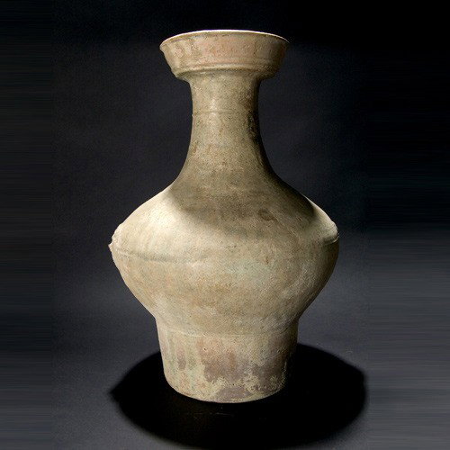 CHINA a pottery vase with four animal head handle: CHINA a pottery vase with four animal head handles. Probably Han dynasty. Height 19 inches; Diameter 12 inches. Glaze degradation. Sale to benefit the programs of Folk Art International Resources for 