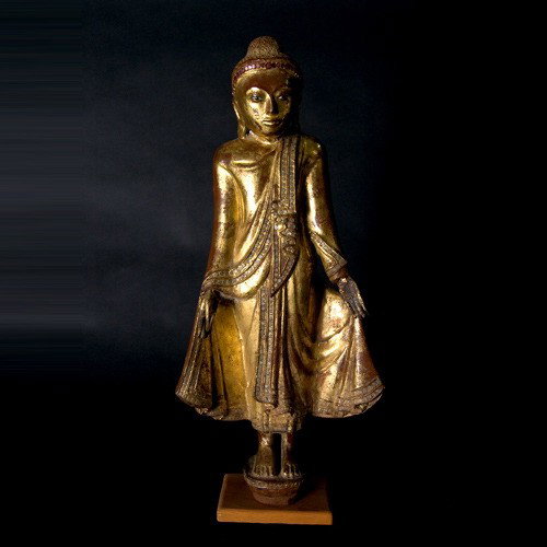 BURMA a gilt & lacquer painted wood Buddhist figu: BURMA a gilt and lacquer painted standing wood Buddhist figure. Height 21 1/4 inches. Sale to benefit the programs of Folk Art International Resources for Education, a nonprofit charitable organizatio