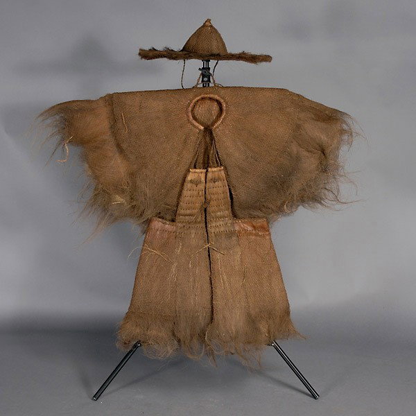 Rain hat and cloak, China: Rain hat and cloak, CHINA. Woven fibers and hairy bark. In good condiiton, has been stored folded.