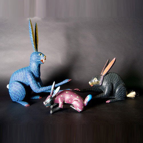 Three Oaxaca rabbits: Three OAXACA rabbits by Maxilmillano Morales Santiago; Moises Jimenez; and Manuel Jimenez. Painted wood. Each signed. Height of one 24 1/2 inches. All in good condition.