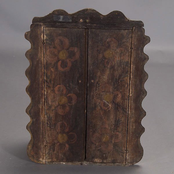 Spanish Colonial santo in niche: SPANISH COLONIAL Santo in altar niche or tabernacle. Possibley 19th century. Wood with red, black, olive, tan paints, glass eyes, tin wings, paper drapery. Height of niche 23 1/4 inches. In good condi