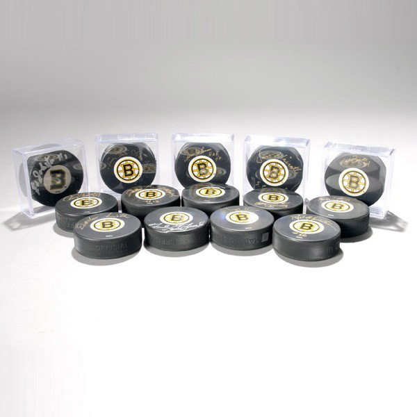 Lot of Autographed Pucks by the Boston Bruins: Boston Bruins Autograph Lot of 14 Official Team Pucks, LOA Provided by JSA Includes HOFers Tom Johnson and John Bucyk