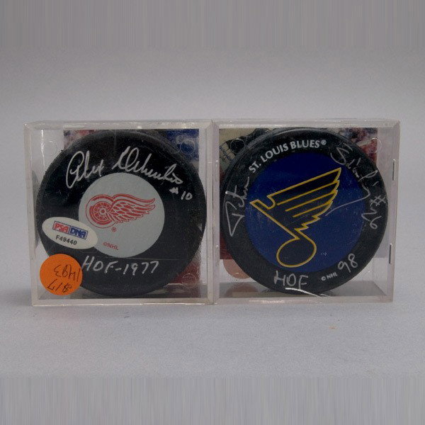 Two HOF Autographed Single Signed Pucks: Two HOF Autographed Single Signed Pucks, Each with COA from PSA/DNA Alex Delvecchio Inscribed "#10" and "HOF 1977," Peter Stastry Inscribed "#26" and "HOF 98"