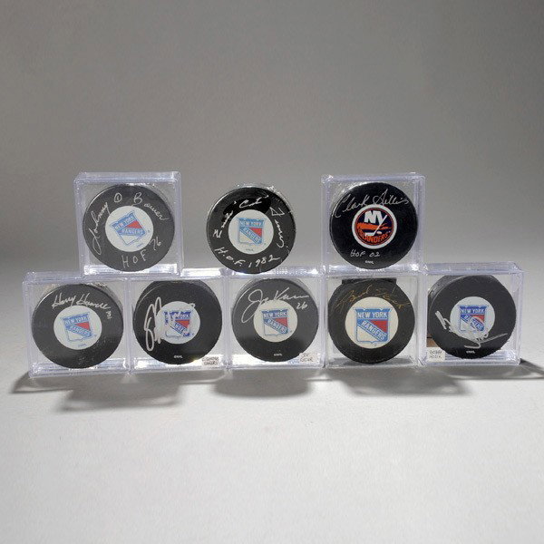 Eight New York Rangers / Islanders Signed Pucks: Eight New York Rangers and New York Islanders Signed Pucks Including Johnny Bowen, Brad Park, Bobbie Hollick and Clark Gillies