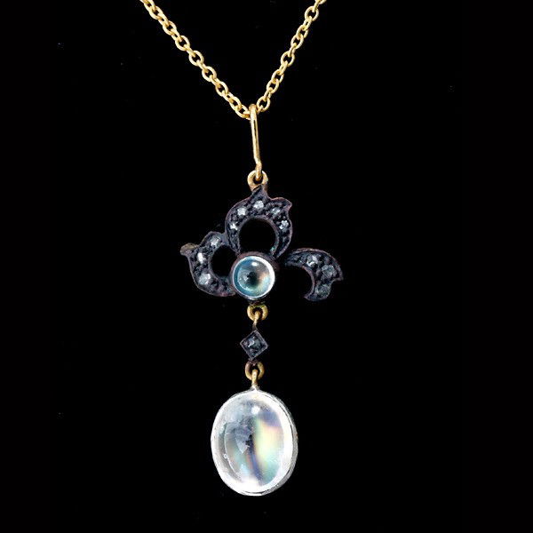 MOONSTONE, DIA., S. GILT, OXID., PENDANT-NECKLACE.: MOONSTONE, DIAMOND, SILVER GILT, OXIDIZED, PENDANT-NECKLACE. Featuring two moonstone cabochons, weighing a total of approximately 2.00 ct., accented by twelve rose-cut diamonds weighing a total of app