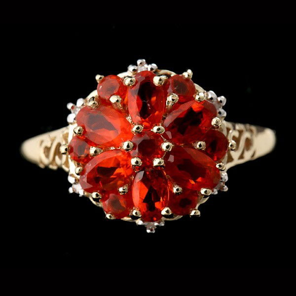 OPAL, 10K YELLOW GOLD RING.: OPAL, 10K YELLOW GOLD RING. Featuring six marquise-cut and seven round-cut opals set in a yellow gold ring mounting. Size 9, 2.4 dwts