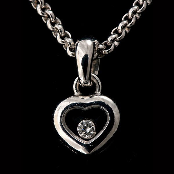 CHOPARD HAPPY DIAMOND, 18K W. GOLD HEART NECKLACE.: CHOPARD HAPPY DIAMOND, 18K WHITE GOLD HEART NECKLACE. Featuring one heart shaped 18k white gold Chopard pendant measuring approximately 10.00 mm, with floating bezel set diamond weighing approximately