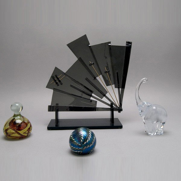 Four Glass Items: an elephant; two paperweights: Four Glass Items: an elephant; two paperweights, one signed "Orient & Flume #F38M1981", the other signed on base; and a fan {Height of fan 13 inches; height of elephant 7 1/4 inches}