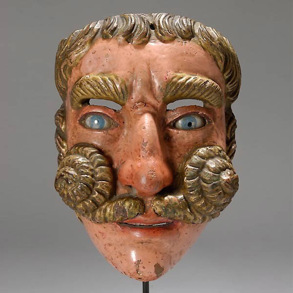guatemalan mask. painted wood w/painted glass eye: GUATEMALAN mask. Painted wood with painted glass eyes. Height 8 3/4 inches. In good condition, paint loss, also in eyes, right eye cracked. On a stand. Provenance: the estates of Douglas Hague and Jor