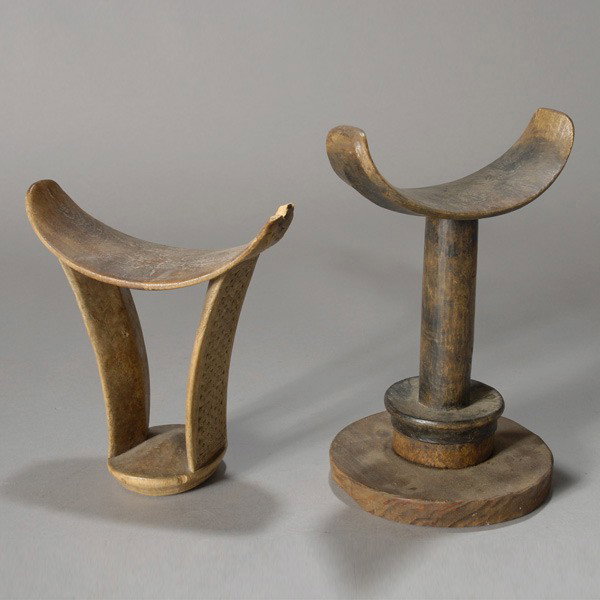 two boni (somalia) headrests.: Two BONI (Somalia) headrests. Wood, incised with geometric patterns. Height of one 6 3/4 inches. One mounted to circular wood base.