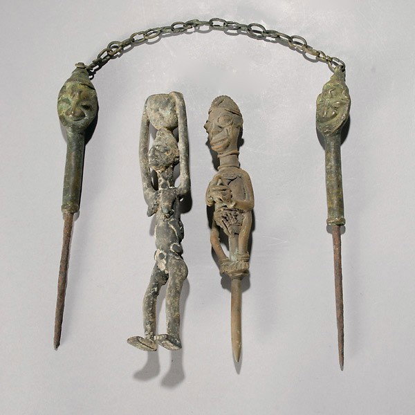 Four WEST AFRICAN cast bronze figures.: Four WEST AFRICAN cast bronze figures. Three Yoruba Ogboni edan staffs (two linked by chain, one full female figure finely cast); one Dogon female carrying vessel on her head. Height of Dogon 10 inche