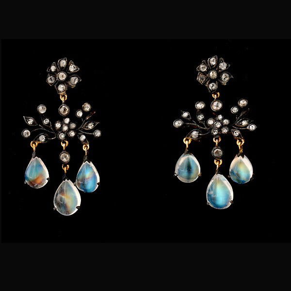 MOONSTONE, DIAMOND, SILVER TOPPED, 9K Y/G EARRINGS: PAIR OF MOONSTONE, DIAMOND, SILVER TOPPED, 9K YELLOW GOLD EARRINGS. Each earring features three pear shape moonstone cabochons accented by twenty-five rose-cut diamonds; the six moonstones weigh a tot