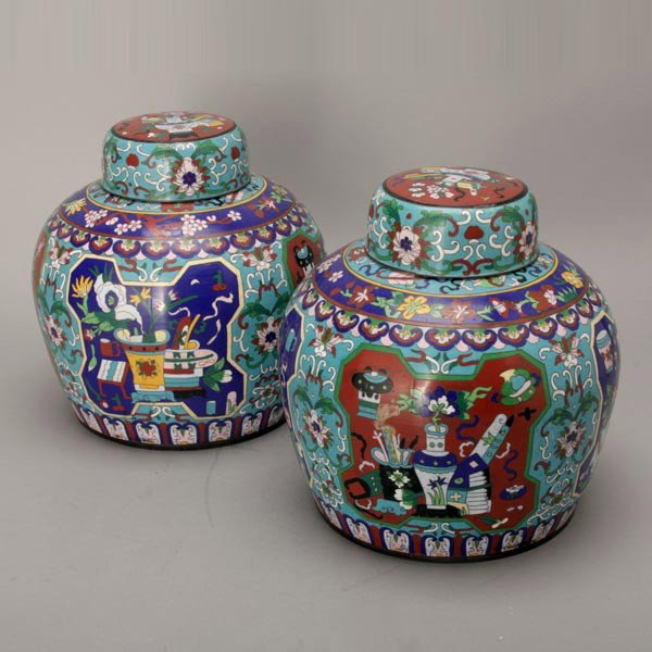 A Pair of Cloisonné-Enameled Ginger Jars: A Pair of Cloisonné-Enameled Ginger Jars, both decorated with reserves enclosing vessels and seasonal flowers to a traditional turquoise ground, each with a matching cover {Height: 9 inches} [Firing 