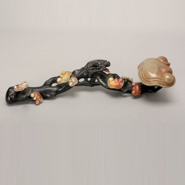 A Dark Wood and Hardstone Ruyi Scepter: A Dark Wood and Hardstone Ruyi Scepter, carved in the likeness of a lingzhi branch with a small beast grasping the handle {Length: 15 inches} [Chips]