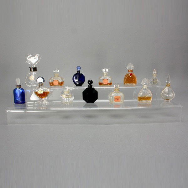 Group of Thirteen Perfume Bottles: Group of Thirteen Perfume Bottles: a D'Orsay France black faceted bottle; three Caron Parfum Bellodgia bottles (two with scent); two Guerlain bottles (one partially full bottle of Shalimar); two cobal