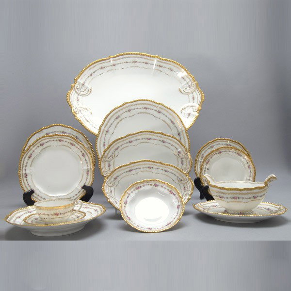 Elite Limoges Porcelain Partial Dinner Service: Elite Limoges Porcelain Partial Dinner Service, Retailed for Higgins & Seiter New York, comprising ten plates (diameter 9 1/2 inches); twelve bowls (diameter 9 1/8 inches, one with chip on base rim, a
