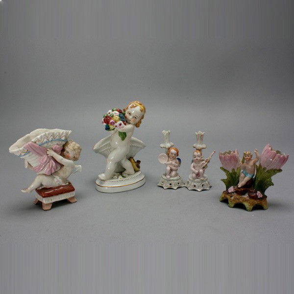 Five German and Japanese Glazed Porcelain Figures: Five German and Japanese Glazed Porcelain Figures with Vases Featuring Winged Cherubs {Height of tallest 5 3/4 inches}