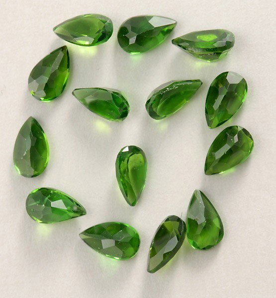 COLLECTION OF UNMOUNTED TSAVORITE GARNETS.: COLLECTION OF UNMOUNTED TSAVORITE GARNETS. Featuring fourteen tsavorite garnets, each measuring approximately 5.00 x 3.00 mm, weighing a total of approximately 3.60 cts.