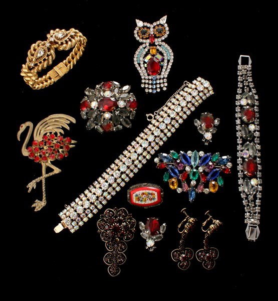 COLLECTION OF RED RHINESTONE COSTUME JEWELRY.: COLLECTION OF RED RHINESTONE COSTUME JEWELRY. Signed Florenza bracelet, signed sterling silver butterfly pin, signed Hobe brooch and earring set, Czech owl brooch, flamingo brooch, rhinestone bracelet