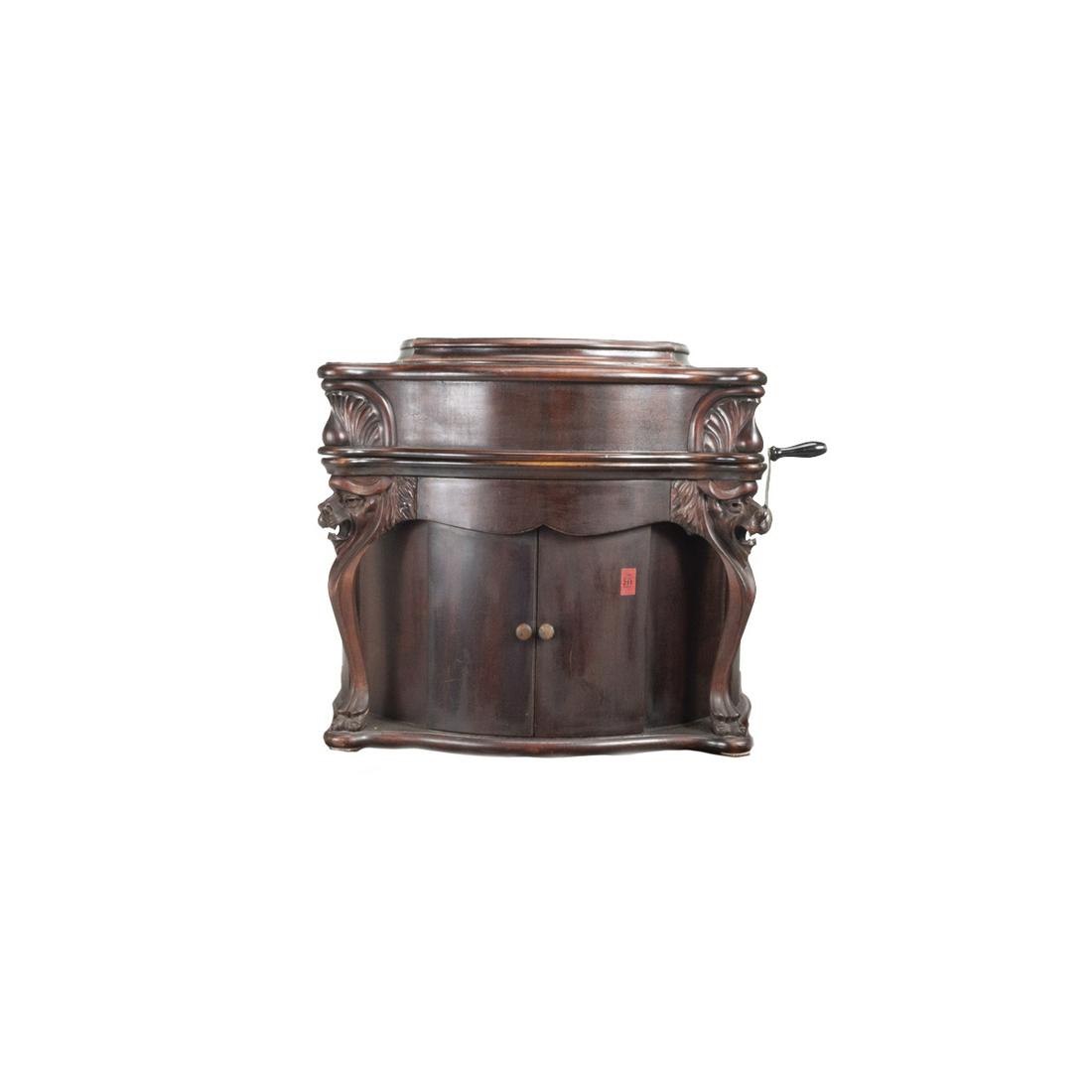 Reginaphone Lion's Head Disc Music Box: Reginaphone Disc Music Box. The case with carved lion supports, single disc included: 'SOLDIERS CHORUS FROM FAUST'. Serial number '2400224' Circa 1900. {Approximate dimensions: 20 1/2 high x 22 wide x