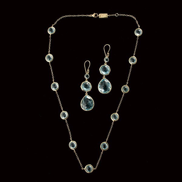 IPPOLITA BLUE TOPAZ, 18K YELLOW GOLD JEWELRY.: COLLECTION OF IPPOLITA BLUE TOPAZ, 18K YELLOW GOLD JEWELRY. Including a pair of earrings featuring two round, two hexagonal and two pear shape blue topaz; including a necklace featuring eleven round b