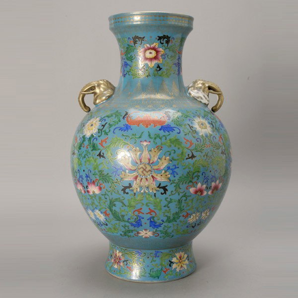 Famille Rose-Enameled Porcelain Vase, Qianlong Mar: A Famille Rose-Enameled Porcelain Vase, Qianlong Mark, of bulbous shape depicting stylized floral scrolls and iron red bats to a turquoise ground, the rim and shoulder decorated with intricately desig