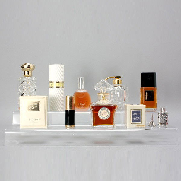 Group of Ten Vintage French Perfume Bottles: Group of Ten Vintage French Perfume Bottles: a Baccarat atomizer; Guerlain "L'Heure Bleue"; two Jean Patou "Joy" (one unopened); Nina Ricca "L' Air du Temps"; Arpege; Chloe; a silver mounted bottle wi