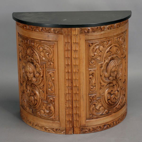 Baroque Style Wood Demilune Cabinet: Baroque Style Wood Demilune Cabinet Centering Masks in Shell Medallions, with associated slate top and extra door {Dimensions 30 3/4 x 33 1/4 x 16 inches} Provenance: the estate of Douglas Hague & Jor
