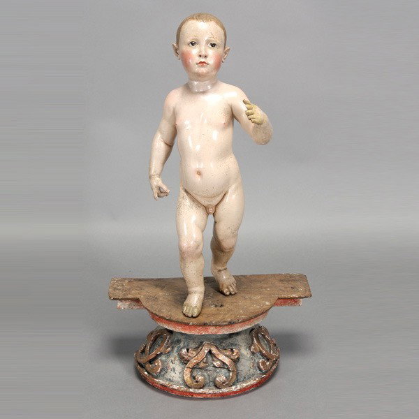 Portuguese Polychrome Wood Figure of Cherub: Portuguese Polychrome, Gessoed Wood Figure of a Cherub, 18th/19th century, carved as a nude male child fitted with glass eyes, mounted on a carved and painted wood base {Height of figure 25 1/2 inches