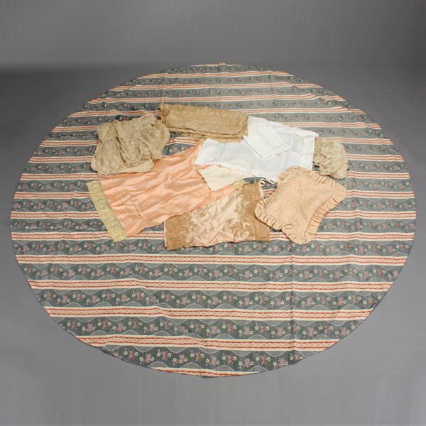 Group of Vintage Lace Bed Coverings: Group of Vintage Lace Bed Coverings: four lace bed coverings; eight assorted pillow cases; five lace doilies; together with a modern round tablecloth [Lace has aged coloring, some small areas of repai