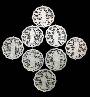 Eight Reticulated White Jade Plaques of Immortals: A Set of Eight Reticulated White Jade Plaques of Immortals, Each figure shown holding an identifiable attribute, floating amidst a reticulated ground of ruyi-headed clouds layered on top of an