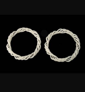 A Pair of Fine White Jade Braided Bangles: A Pair of Fine White Jade Braided Bangles, Both of beautifully even white tone with a rich lustrous quality, elegant and unique multi strand design, each smoothly rounded section delicately twisting