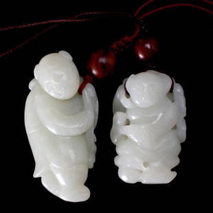 Two Small Qing Dynasty White Jade Boys: Two Small White Jade Boys, Both of mottled white hues with a lustrous quality, well executed with incised details and features, one displaying opaque milky white patches and natural fissure lines,