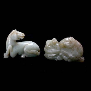 Two Recumbent Jade Horses: Two Recumbent Jade Horses, Both resting in a reclining position with their heads turned behind them, one accompanied by a monkey, deep mottled celadon hues exhibiting slight dark brown patches and