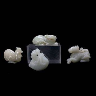 Four Jade Animal Carvings: Four Jade Animal Carvings, Each of pale greenish-white tones with finely incised features and details; the first a reclining horse with a monkey sprawled on its back; the second a snarling cat figure