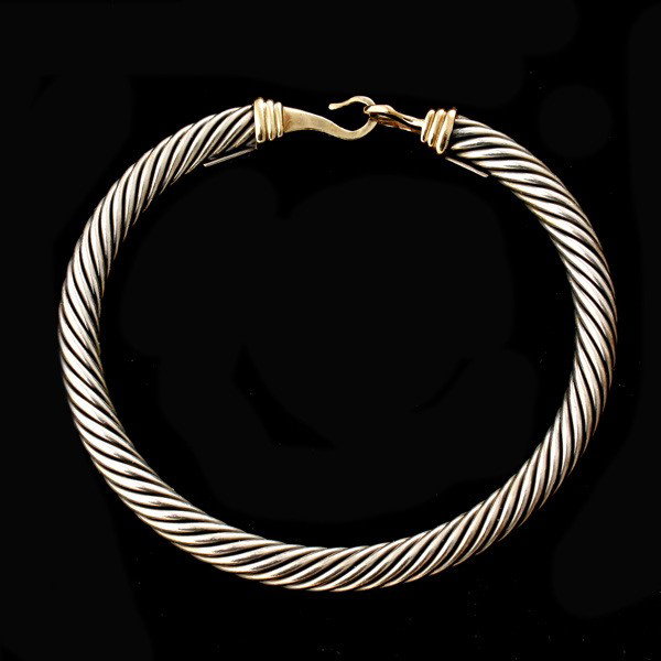 14K Y/G, S/S BANGLE BRACELET, DAVID YURMAN.: 14K YELLOW GOLD, STERLING SILVER BANGLE BRACELET, DAVID YURMAN. Featuring a sterling silver twist motif completed by a 14k yellow gold clasp, signed David Yurman. 18.50 dwts