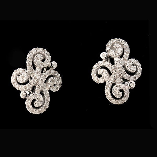 DIAMOND, 14K WHITE GOLD EARRINGS.: DIAMOND, 14K WHITE GOLD EARRINGS. Each features sixty round-cut diamonds weighing a total of approximately 0.50 ct., all bead set in a 14k white gold swirl motif completed by a post and omega back. 4.