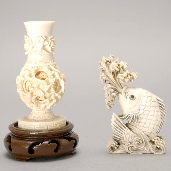 Two Ivory Carvings*: Two Ivory Carvings*, includig a fish snuff bottle and a puzzle ball vase with matching wood stand {Height of Vase: 4 1/4 inches}