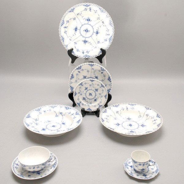 Royal Copenhagen Service in Blue Fluted Full Lace: Royal Copenhagen Partial Dinner Service in the Blue Fluted Full Lace Border Pattern: twelve dinner plates (diameter 10 inches, one with rim chip); twelve salad plates (diameter 9 3/4 inches, one with 