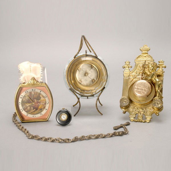 Two Pocket Watch Holders;watch; clock and pendant: Two Pocket Watch Holders; a gold filled pocket watch; a Swiss eight day clock with chain; and a miniature pendant watch (5) {Height of tallest 6 3/4 inches}
