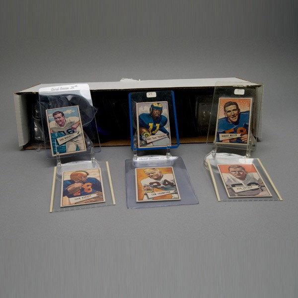 BOWMAN 1952 FOOTBALL CARD "SMALL" COMPLETE SET.: FOOTBALL: BOWMAN 1952 FOOTBALL CARD "SMALL" COMPLETE SET. Scarce set including #1-144. Two graded by PSA, #54-6, #64-6, all others individual plastic sleeves. Fresh and mostly well centered overall. G