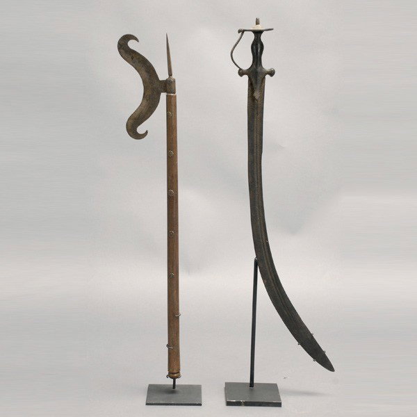 2 India swords Indian tribal art: Two swords from Southern INDIA. One scimitar, the other probalby ceremonial. Length of scimitar 32 1/2 inches. Both in good condition, with custom stands.